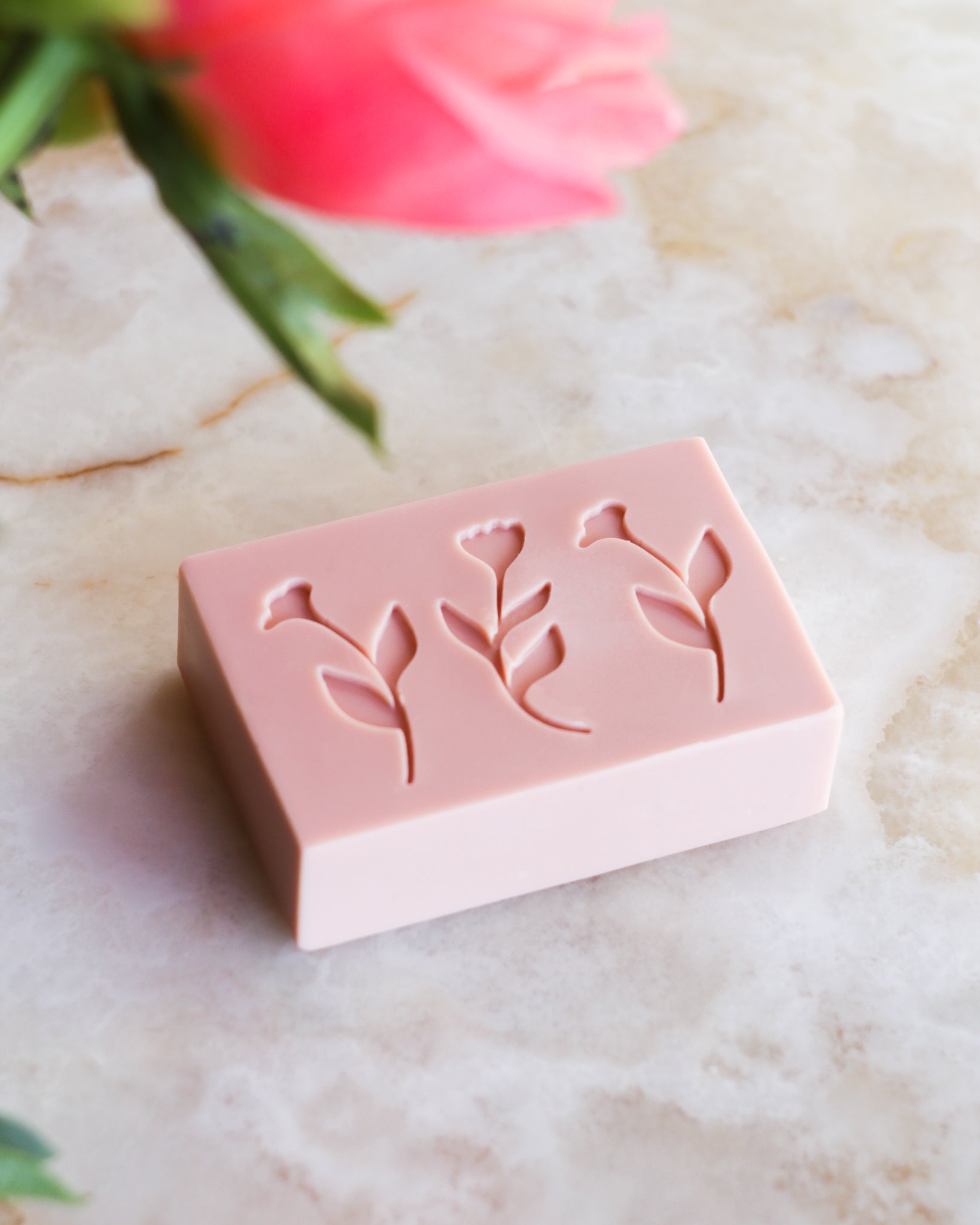 a soap stamped with 3 flowers